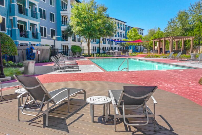 Relax poolside on the sundeck at our luxury Stone Oak apartments.